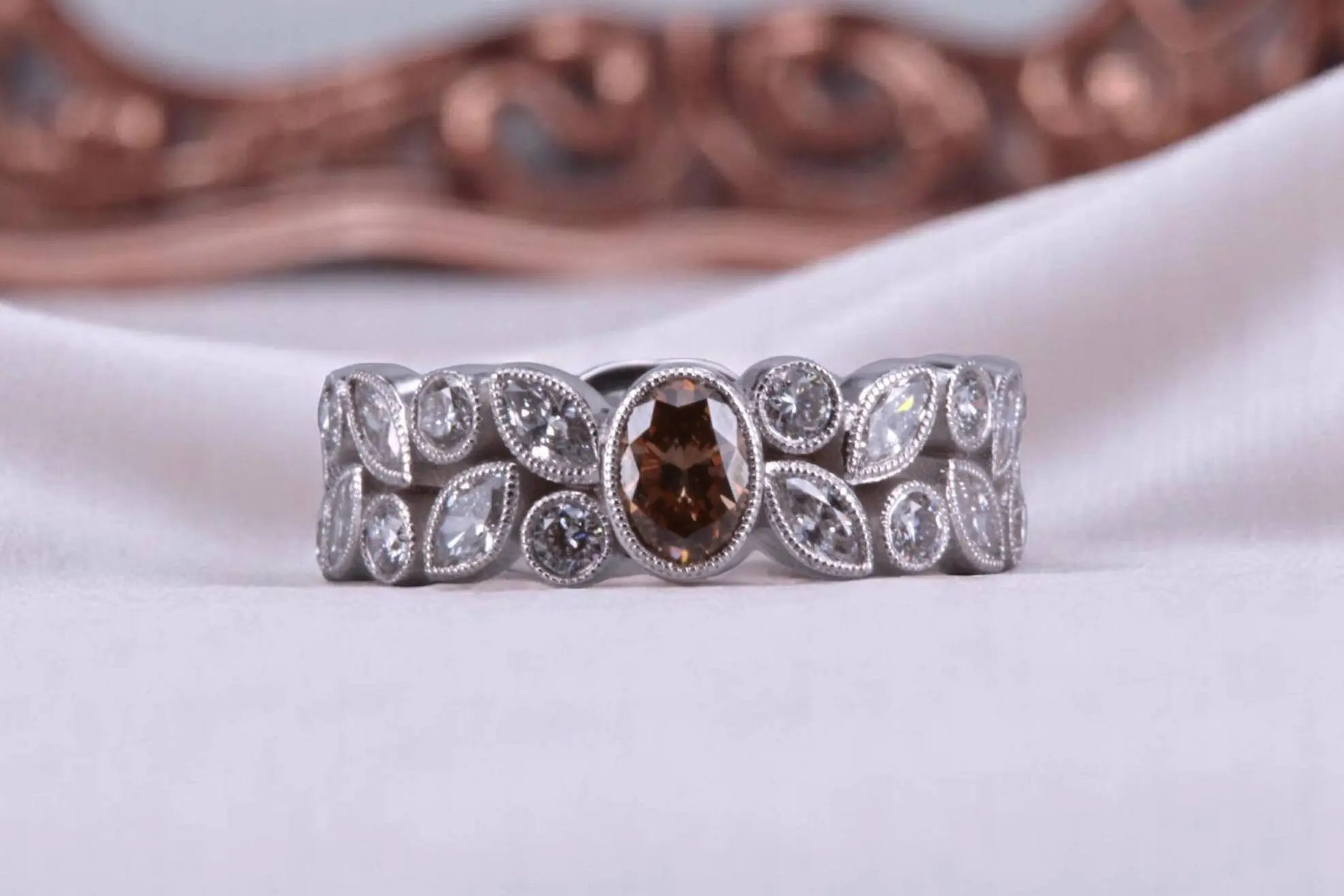 Non-traditional rootbeer diamond floral ring for couples in Carmel Valley